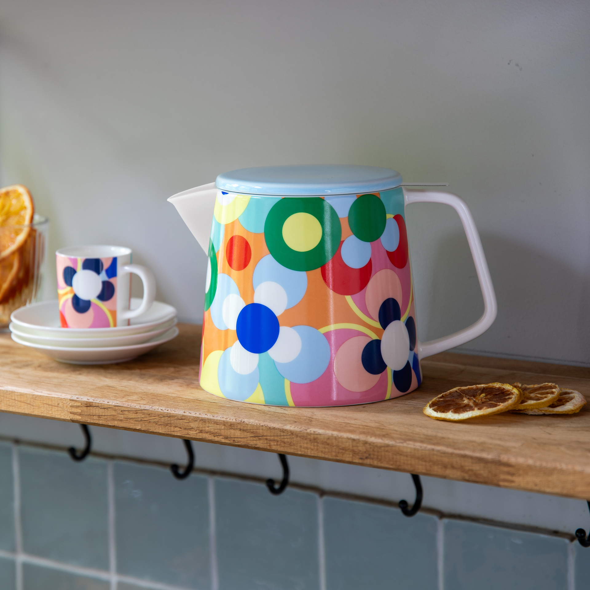 Remember Sushi teapot styled on a shelf with a matching cup